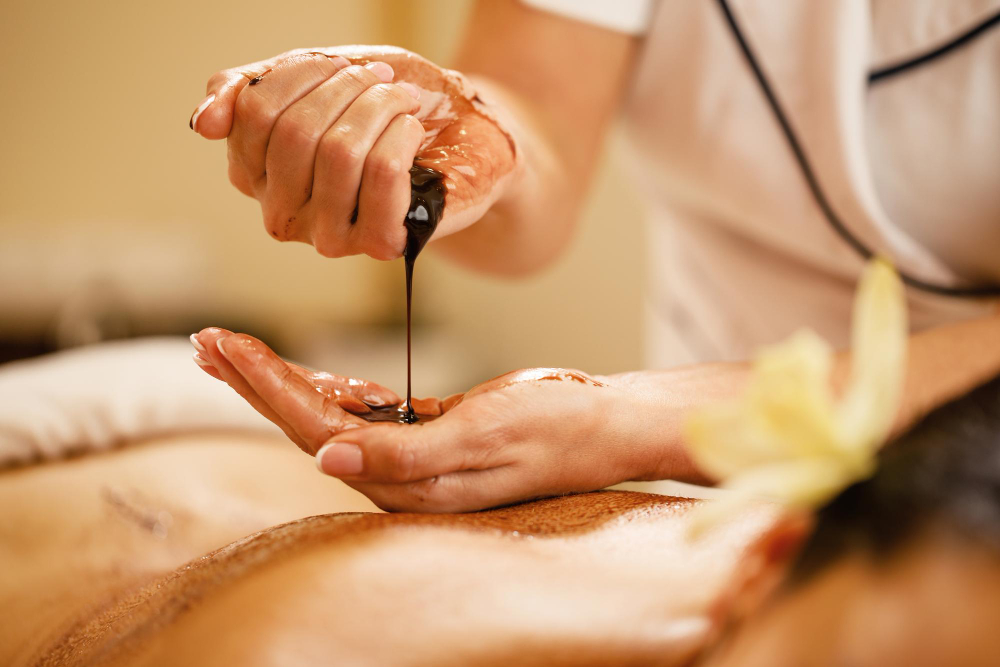 Serene spa treatment room with candles, essential oils and peaceful ambiance at Me Wellness & Spa